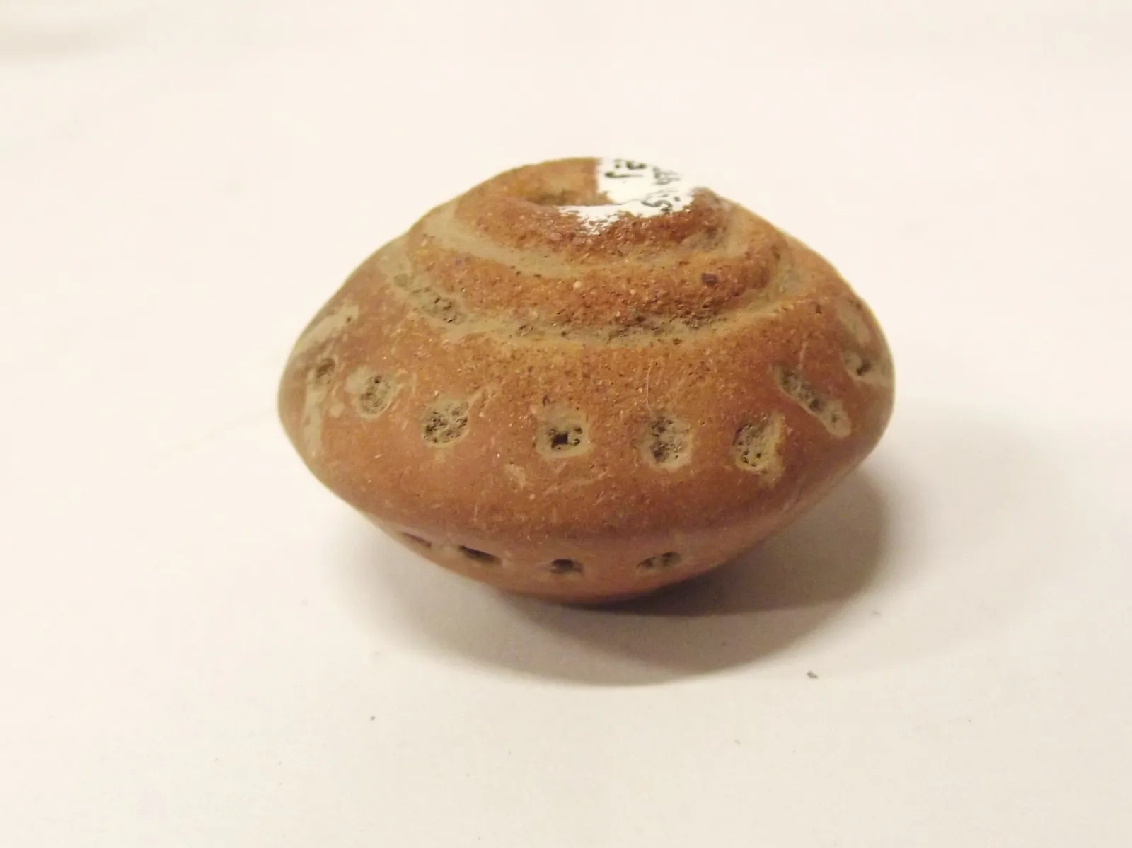 Sello de barro cocido