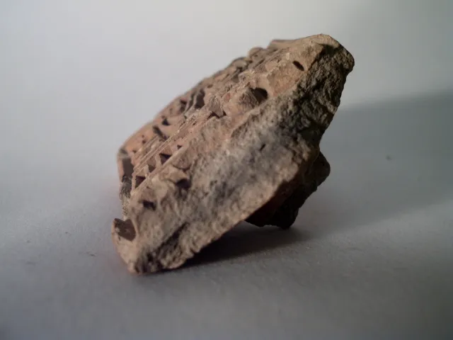 Sello de barro cocido