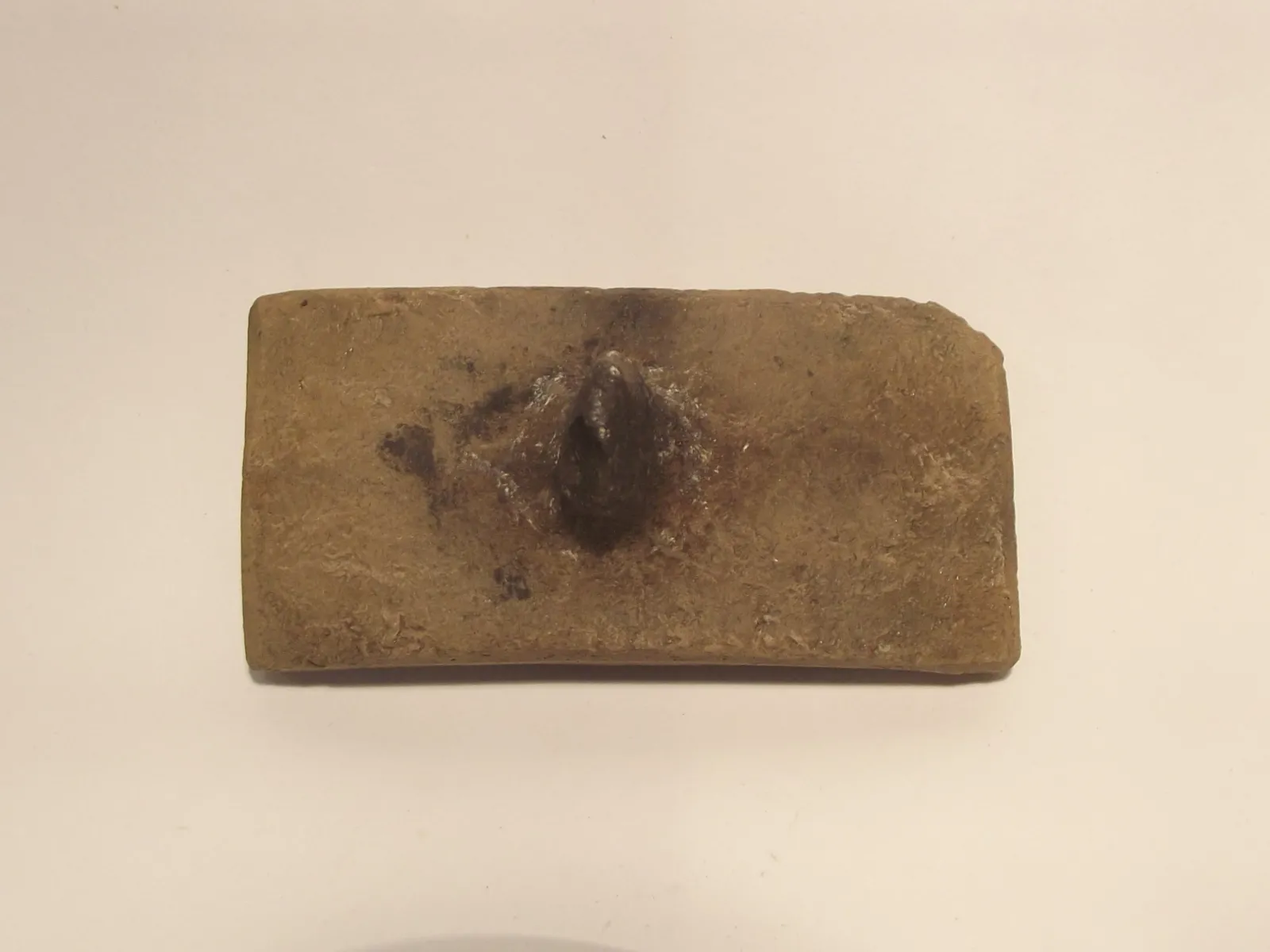 Sello de barro cocido