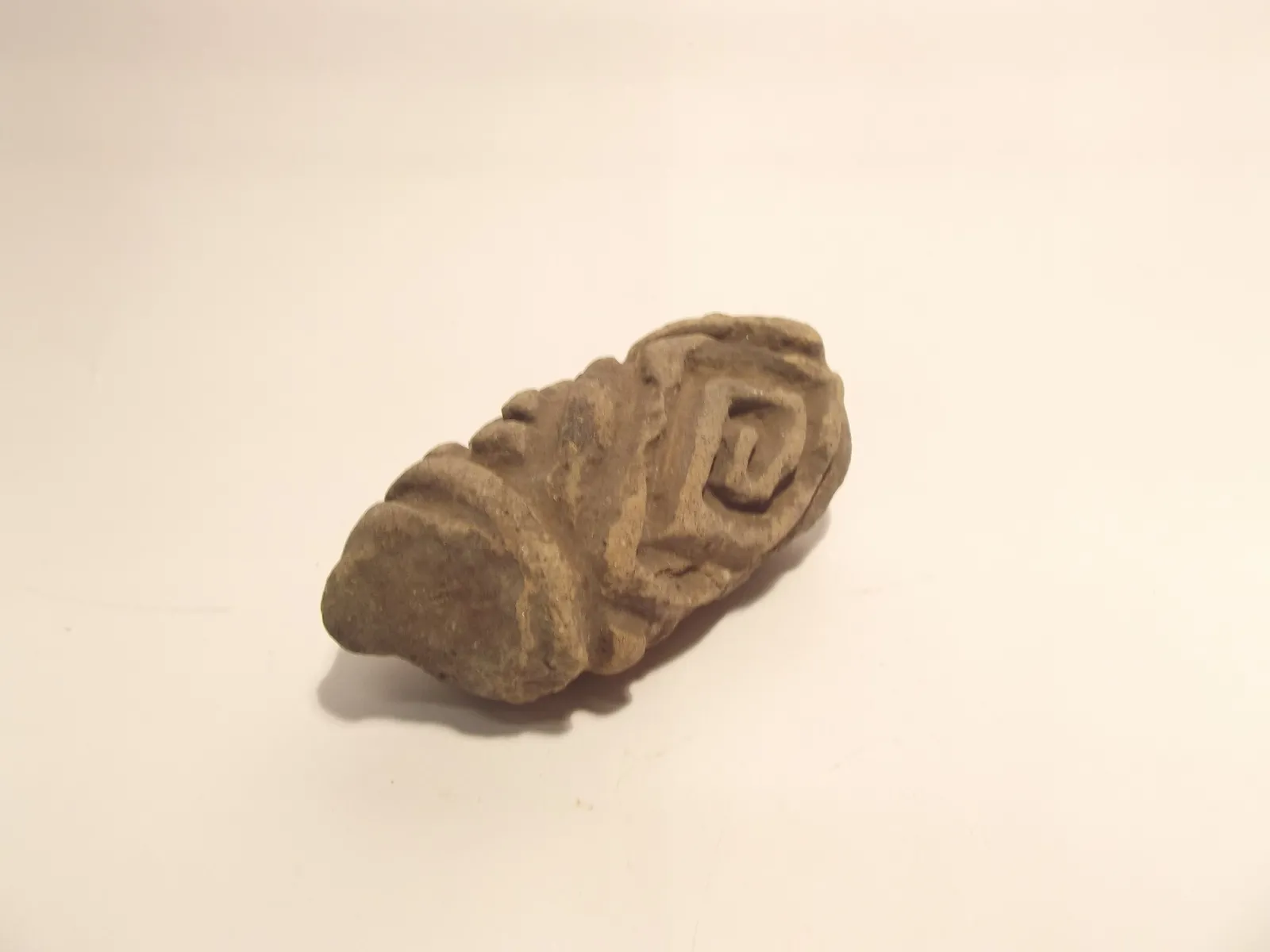 Sello de barro cocido