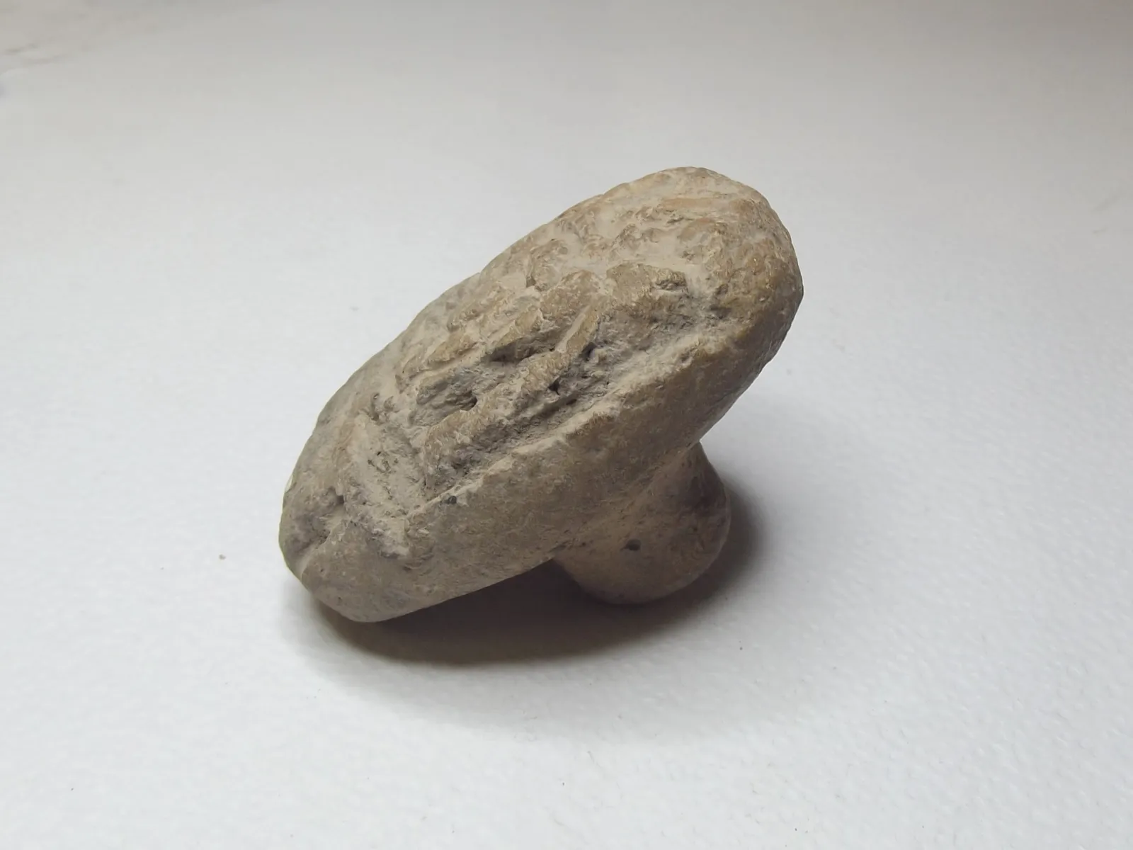 Sello de barro cocido
