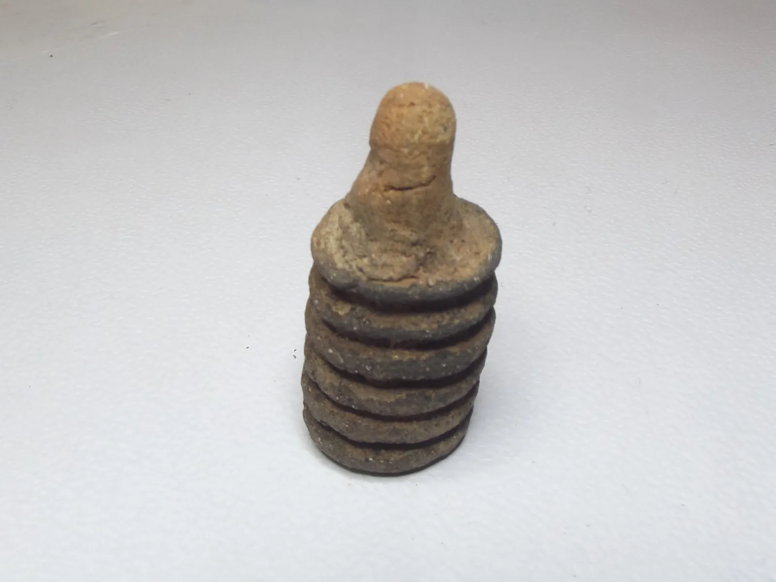 Sello de barro cocido