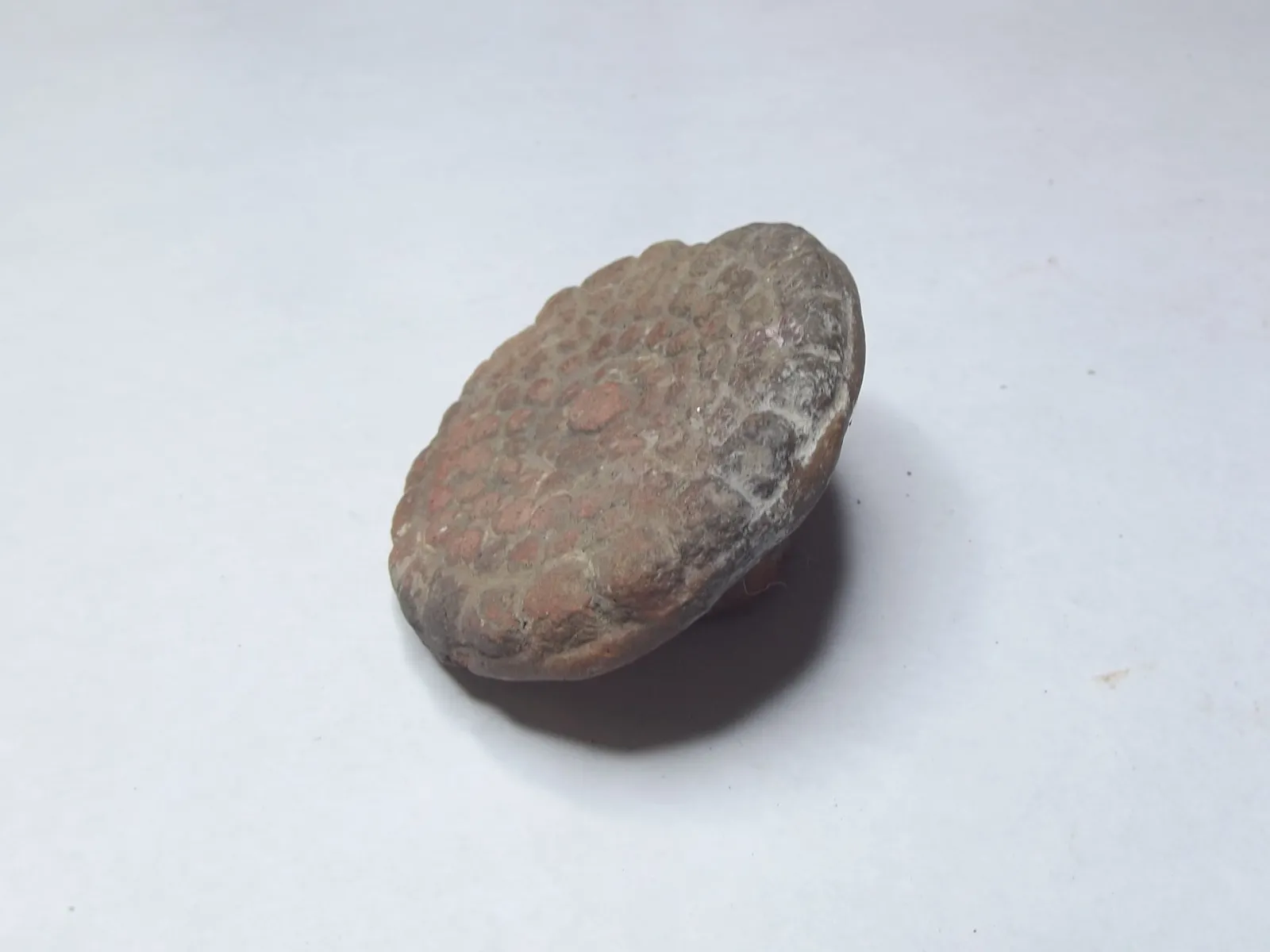 Sello de barro cocido
