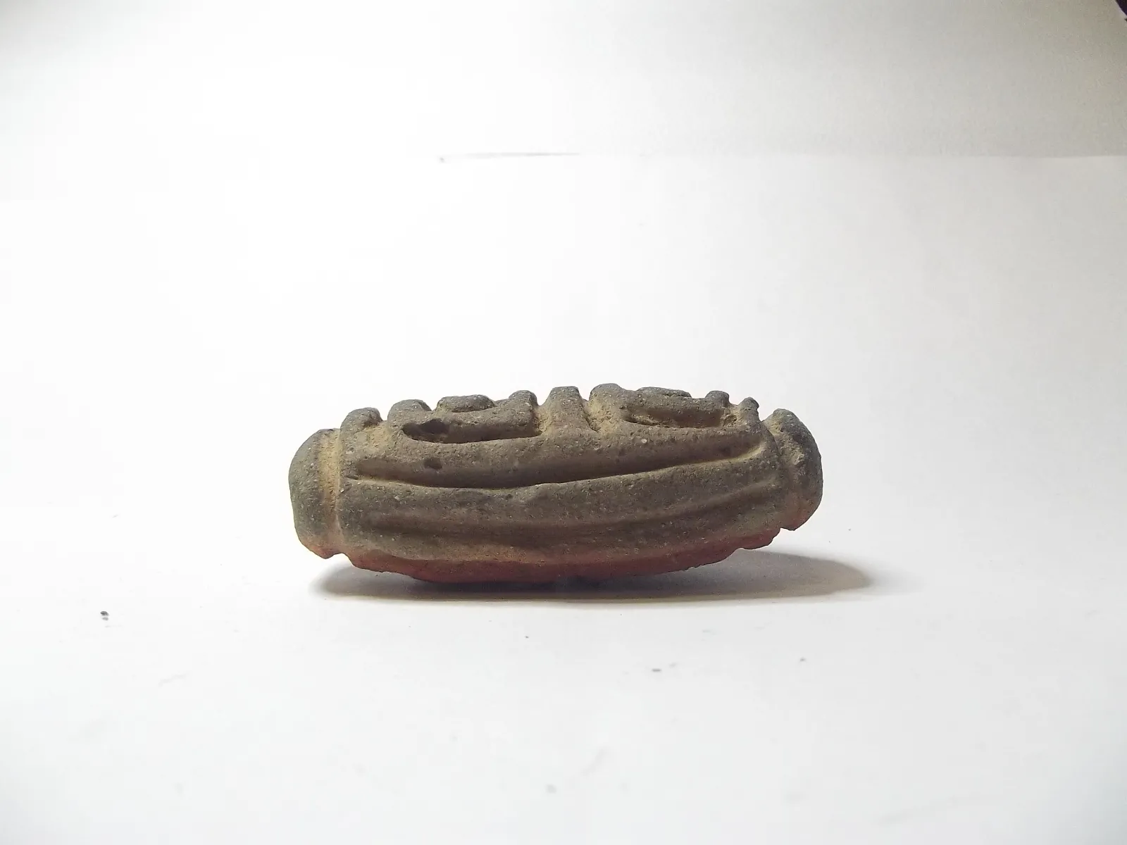 Sello de barro cocido