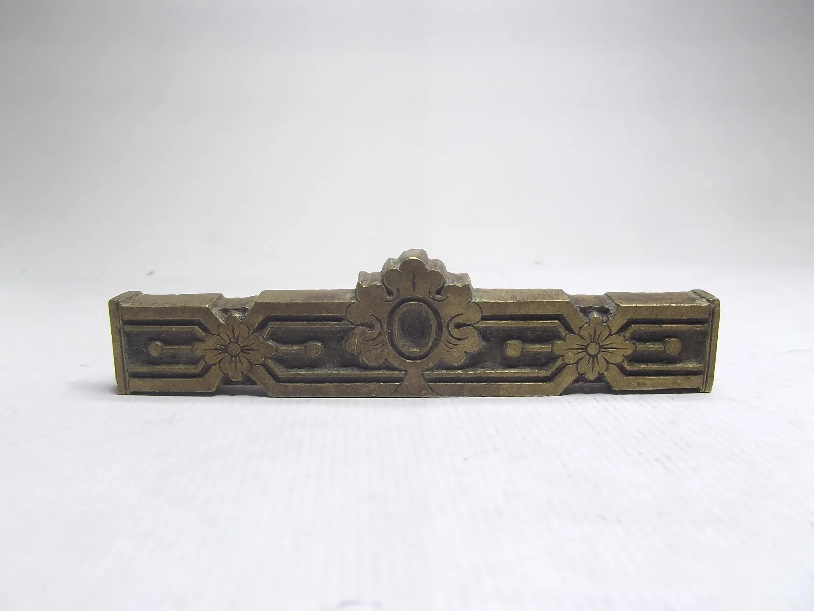 Sello de bronce