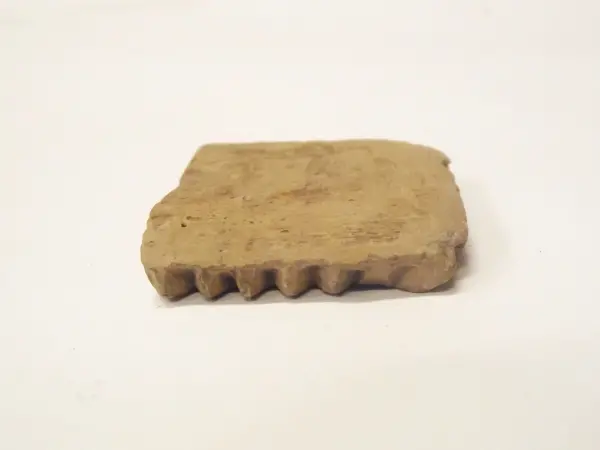 Sello de barro cocido
