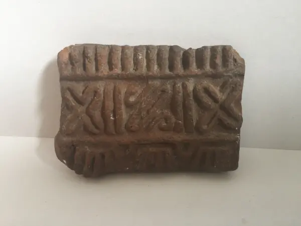 Sello de barro cocido