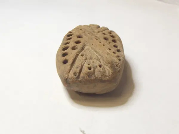 Sello de barro cocido