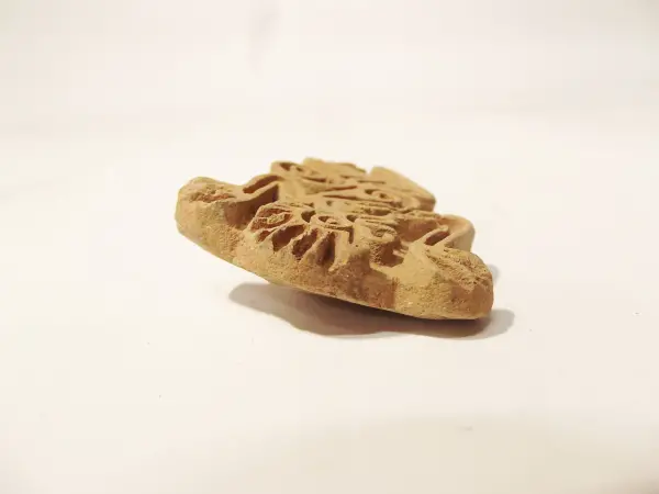 Sello de barro cocido
