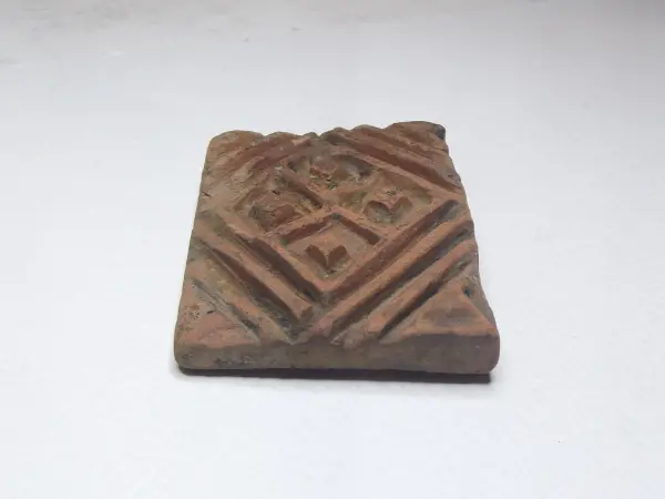 Sello de barro cocido