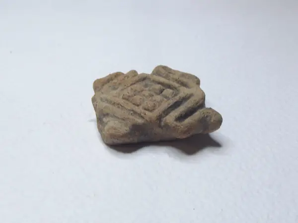 Sello de barro cocido