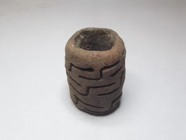 Sello de barro cocido