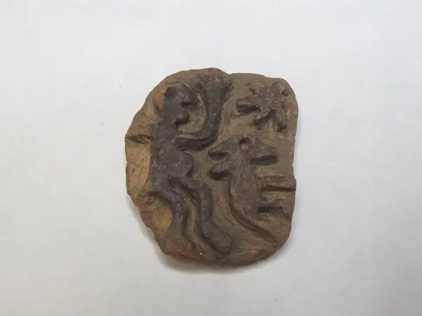 Sello de barro cocido