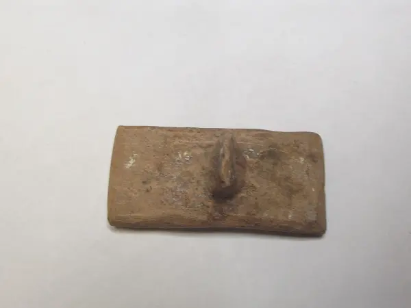 Sello de barro cocido