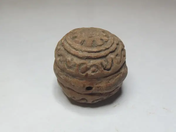 Sello de barro cocido