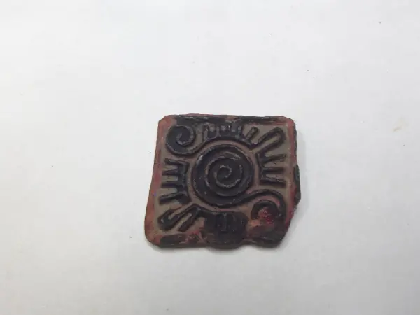 Sello de barro cocido