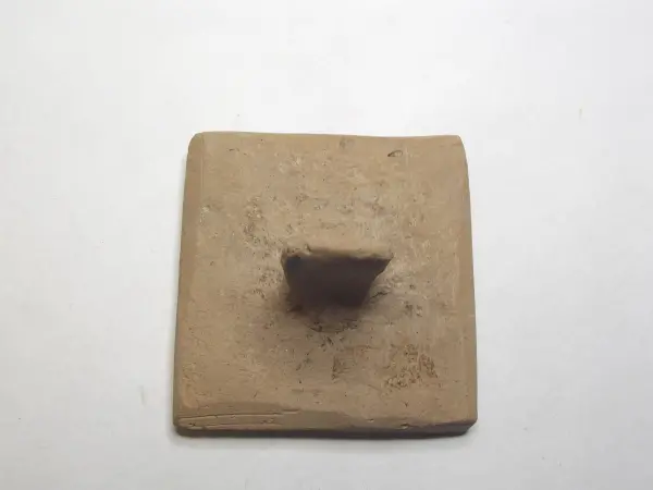 Sello de barro cocido