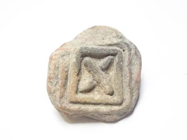 Sello de barro cocido
