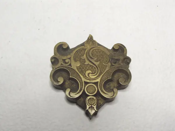 Sello de bronce