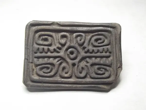 Sello de barro cocido